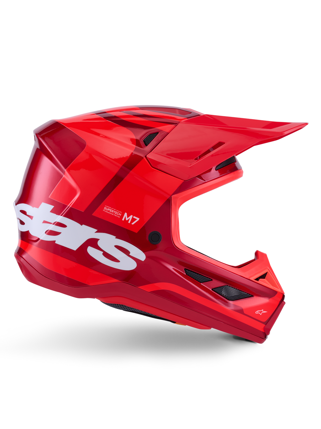 Alpinestars S-M7 Core helm, motorcrosshelm, glanzend rood met donkerrode accenten en witte branding, zijaanzicht met groot wit stars-logo, aerodynamische schaal met mesh ventilatieopeningen en een opvallende klep