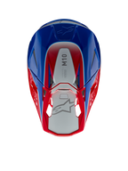 Casque Alpinestars Supertech M10 Aeon, casque de motocross, rouge vif et bleu brillant, vue de dessus montrant le panneau central argenté avec marquage M10, coque aérodynamique avec accents rouges et bleus, grilles de ventilation en maille, protection de tête haute performance pour le motocross
