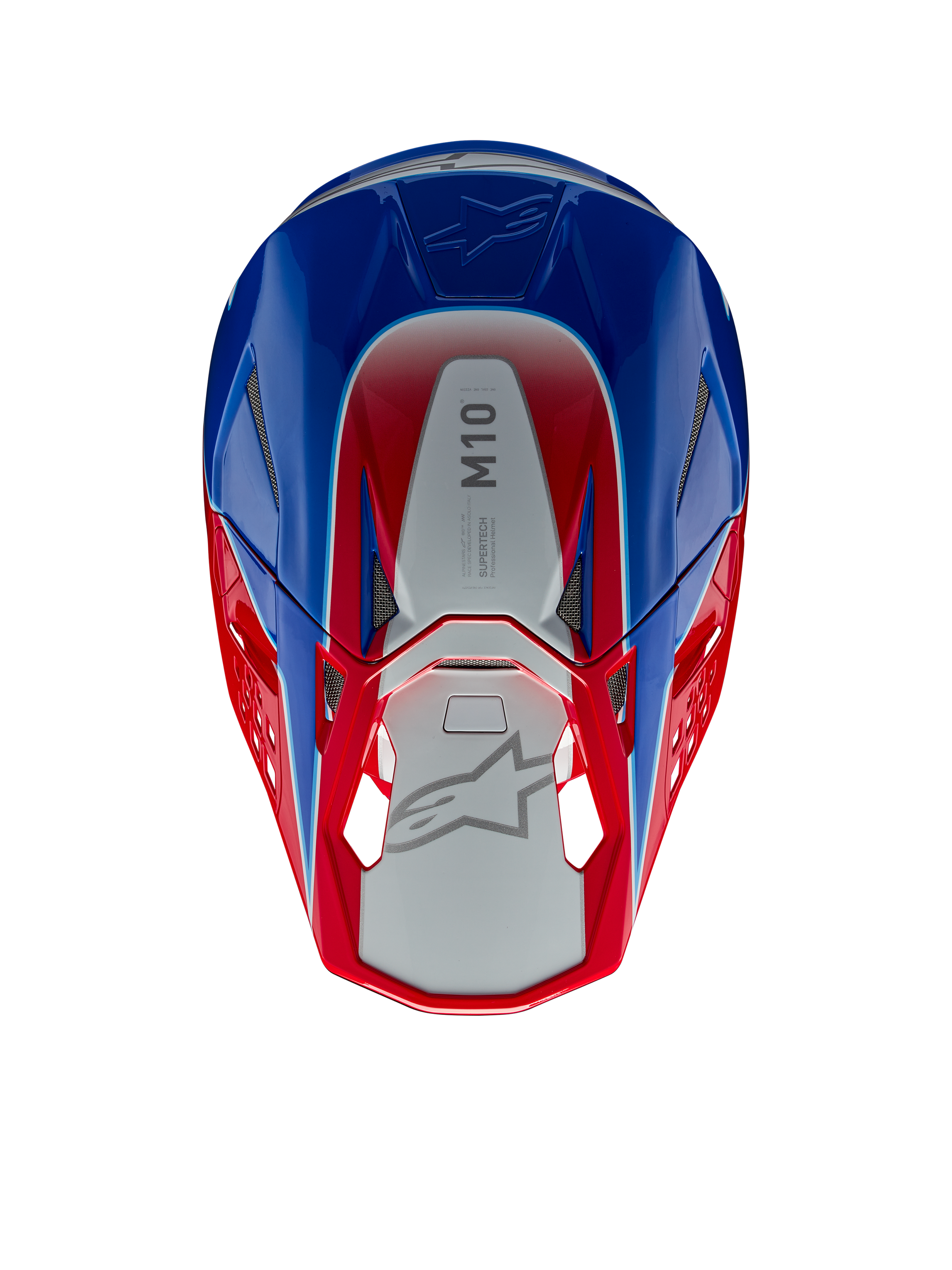 Casque Alpinestars Supertech M10 Aeon, casque de motocross, rouge vif et bleu brillant, vue de dessus montrant le panneau central argenté avec marquage M10, coque aérodynamique avec accents rouges et bleus, grilles de ventilation en maille, protection de tête haute performance pour le motocross