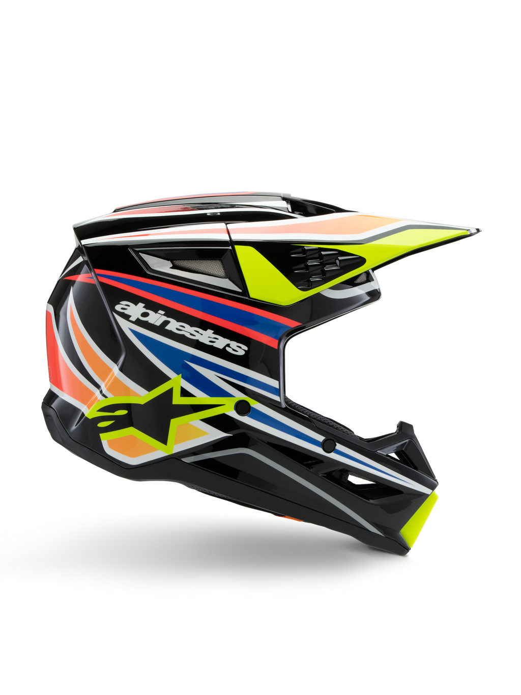 Alpinestars S-M3 Youth Wurx helm, jeugd motorcrosshelm, zwart met gele, blauwe, rode en oranje grafische strepen, zijprofiel met aerodynamisch vizier en glanzende afwerking, voorzien van wit Alpinestars logo en gele ster-graphic