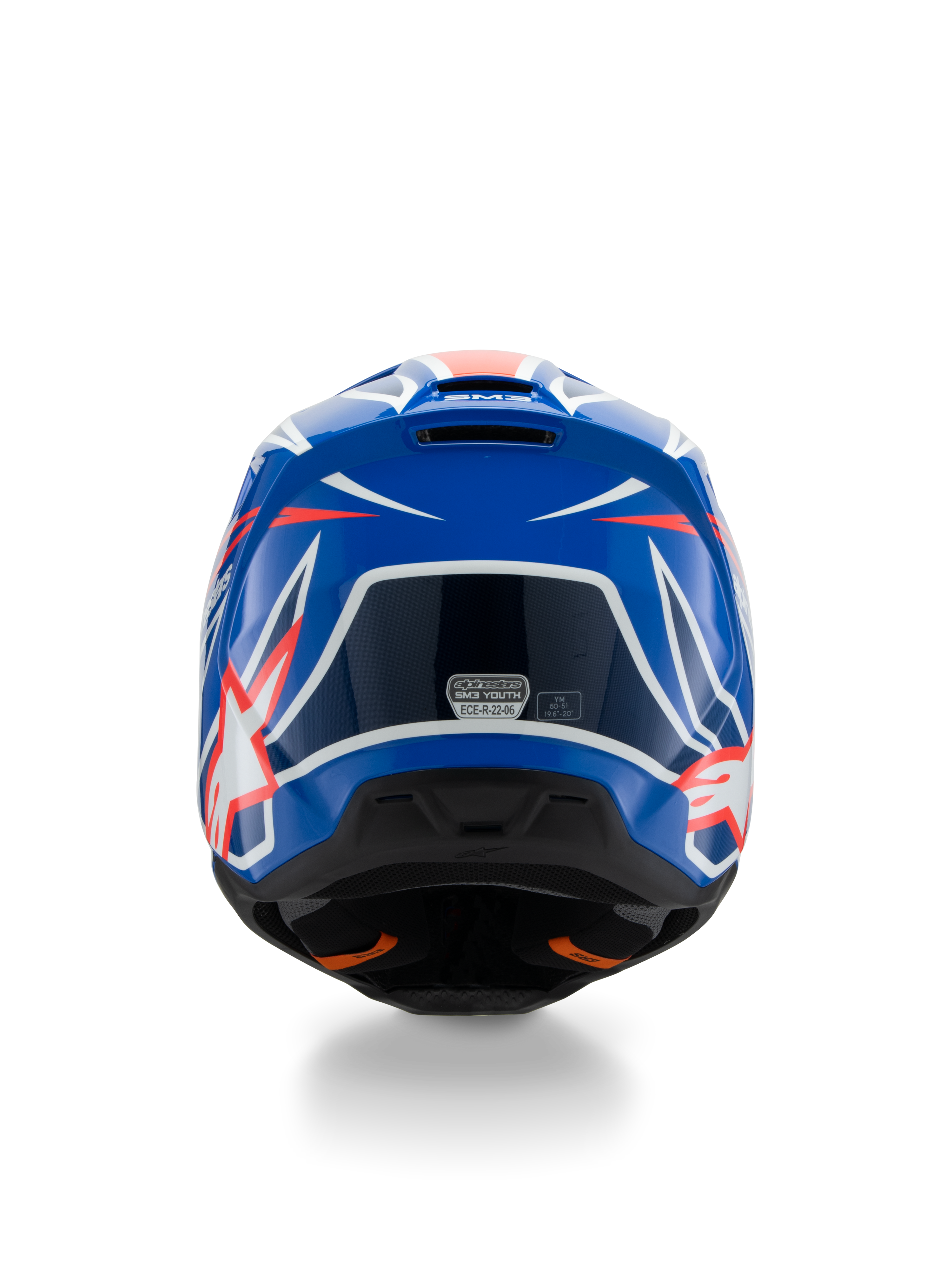 Casque Alpinestars S-M3 Youth Wurx ECE 22.06, casque de motocross, bleu, rouge et blanc, vue arrière montrant le design aérodynamique avec des extracteurs d'air, finition brillante avec des accents graphiques vifs et autocollant de certification de sécurité.