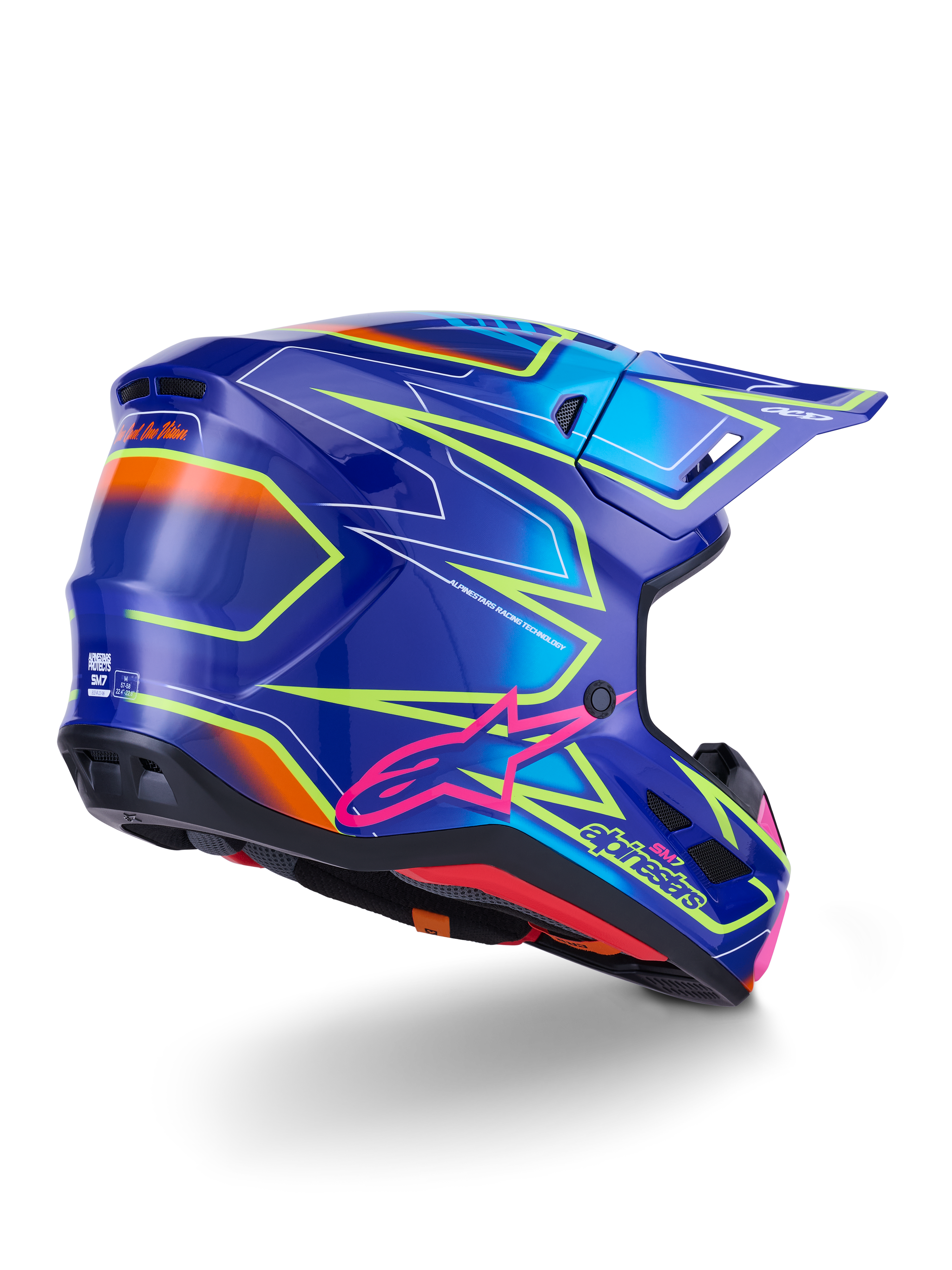 Casque Alpinestars S-M7 Cast, casque de motocross, bleu, rose et jaune fluo brillant, vue arrière de trois-quarts montrant la coque aérodynamique aux graphismes angulaires marqués, logo Astar rose et ports de ventilation intégrés pour la course tout-terrain