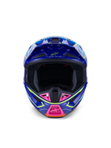 Alpinestars S-M7 Cast Helm ECE 22.06, motorcrosshelm, blauw, roze en geel fluo glanzend, vooraanzicht met agressieve aerodynamische schaal, geventileerde kinbescherming met roze accenten en brede oogopening voor off-road racen