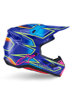 Casque Alpinestars S-M7 Cast, casque de motocross, bleu, rose et jaune fluo brillant, vue de profil avec motifs géométriques audacieux, logo Alpinestars rose et coque aérodynamique ventilée.