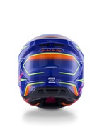 Casque Alpinestars S-M7 Cast ECE 22.06, casque de motocross, bleu, rose et jaune fluo brillant, vue arrière montrant le slogan 'One Goal. One Vision.', coque composite aérodynamique avec ports de ventilation intégrés et accents néon vibrants