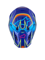 Casque Alpinestars S-M7 Cast, casque de motocross, bleu, rose et jaune fluo brillant, vue de face présentant des lignes géométriques jaune fluo éclatantes, logo étoile Alpinestars rose sur la mentonnière et logo étoile bleu clair sur la zone de la visière, conception de coque aérodynamique pour la course tout-terrain