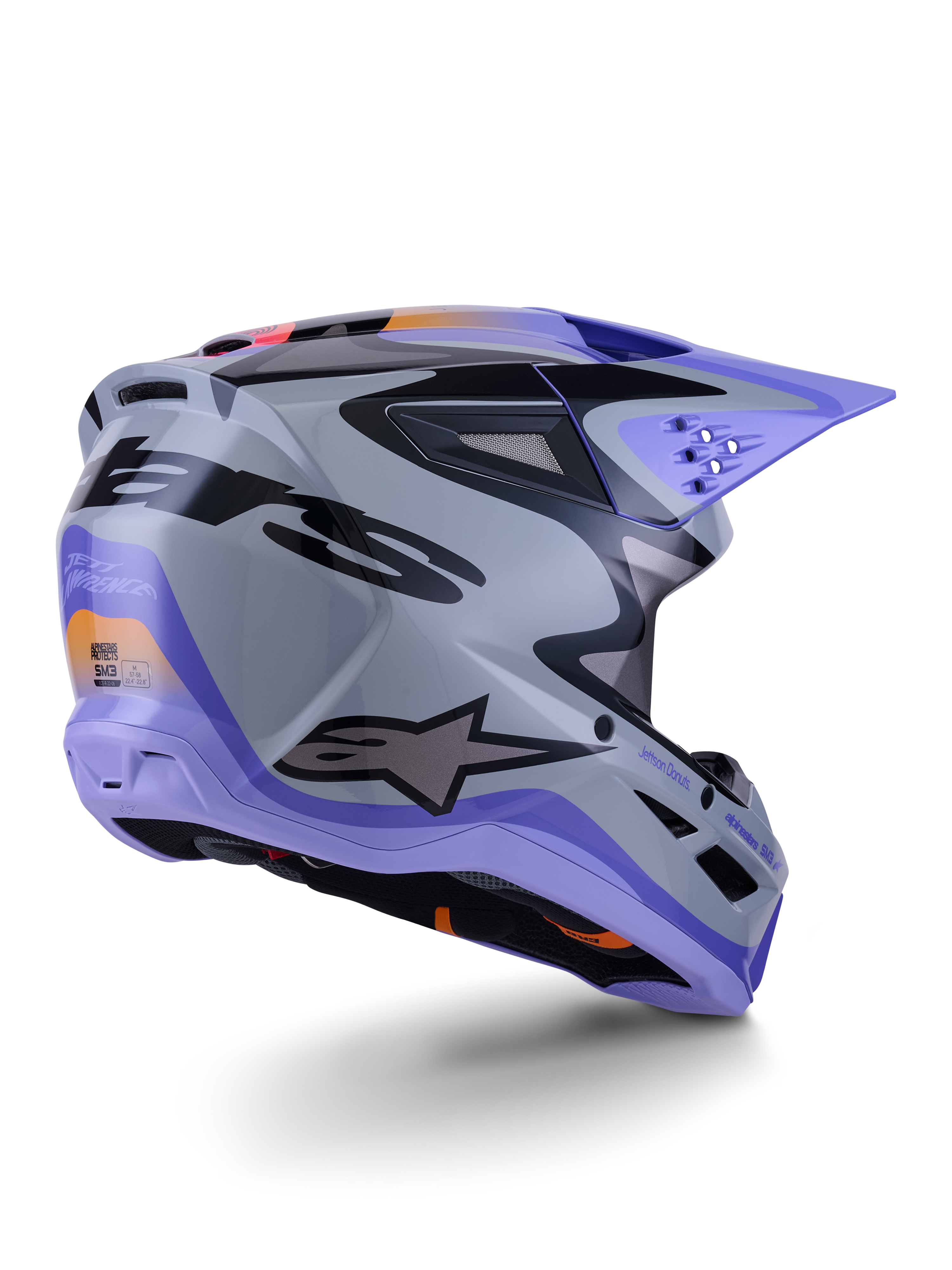 Alpinestars S-M3 Jettson ECE 22.06, casque de motocross, gris, violet et noir brillant, vue de trois-quarts arrière montrant la coque thermo-injectée aérodynamique avec des ports de ventilation et un design graphique audacieux