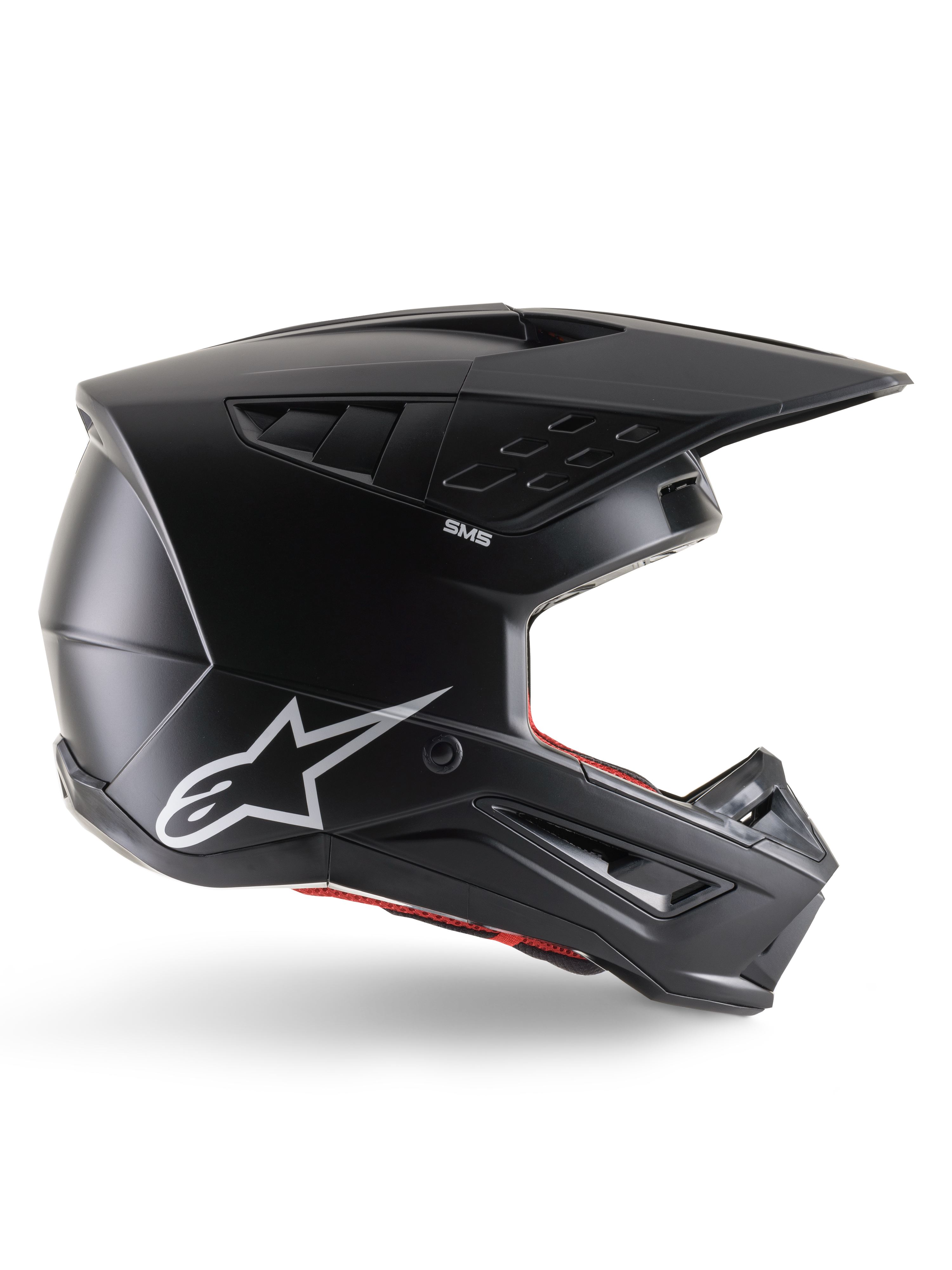Casque Alpinestars S-M5 Solid, casque de motocross, noir mat, logo étoile Alpinestars blanc et doublure intérieure rouge, design aérodynamique avec multiples évents et visière longue, protection tout-terrain certifiée ECE 22.06