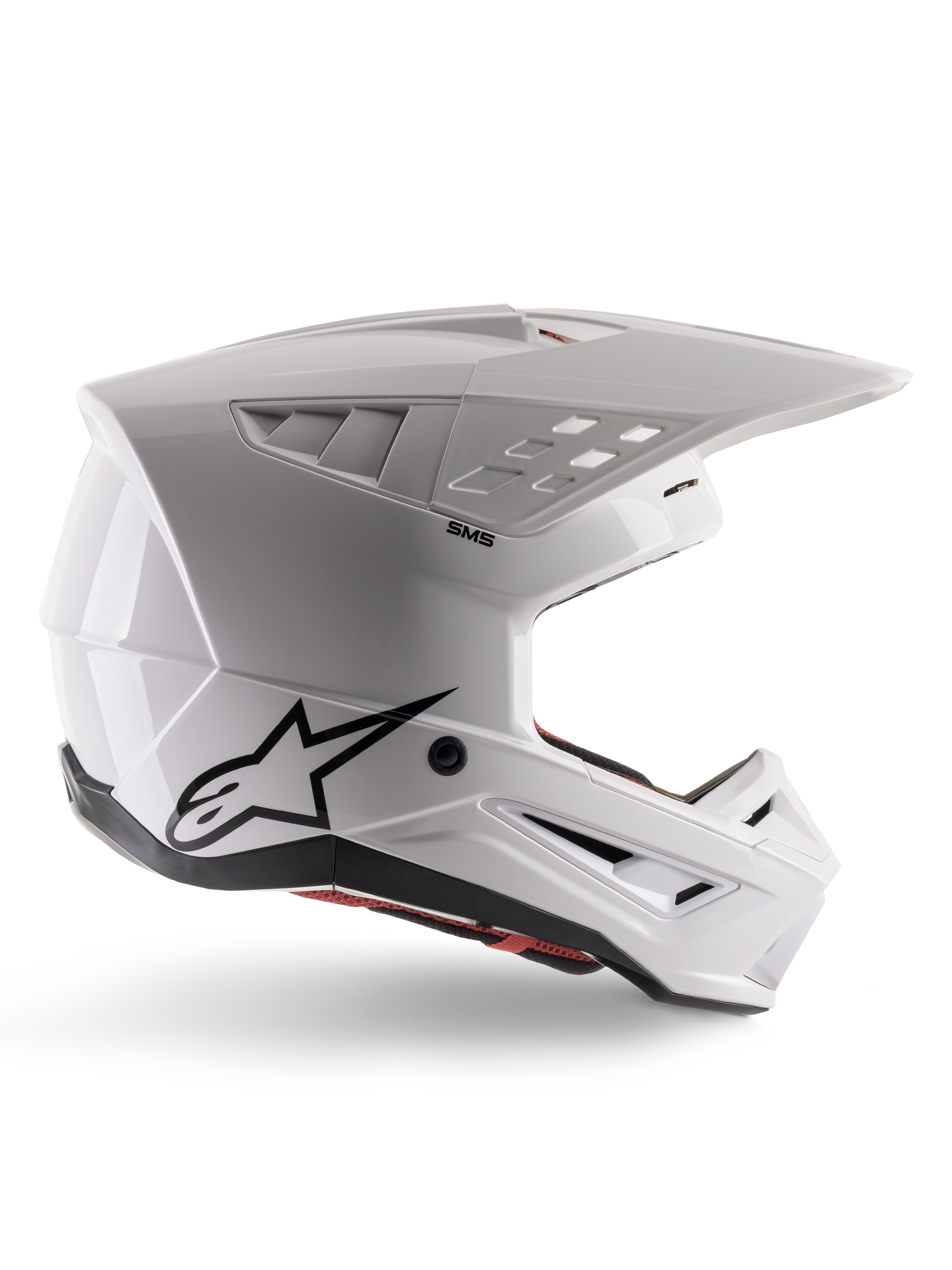 Alpinestars S-M5 Solid Helm ECE 22.06, motorcrosshelm, glanzend wit, zijprofiel met hoekig aerodynamisch ontwerp, opvallende klep, geïntegreerde ventilatieopeningen, zwart Astars-logo op de achterkant en zichtbare rode binnenvoering