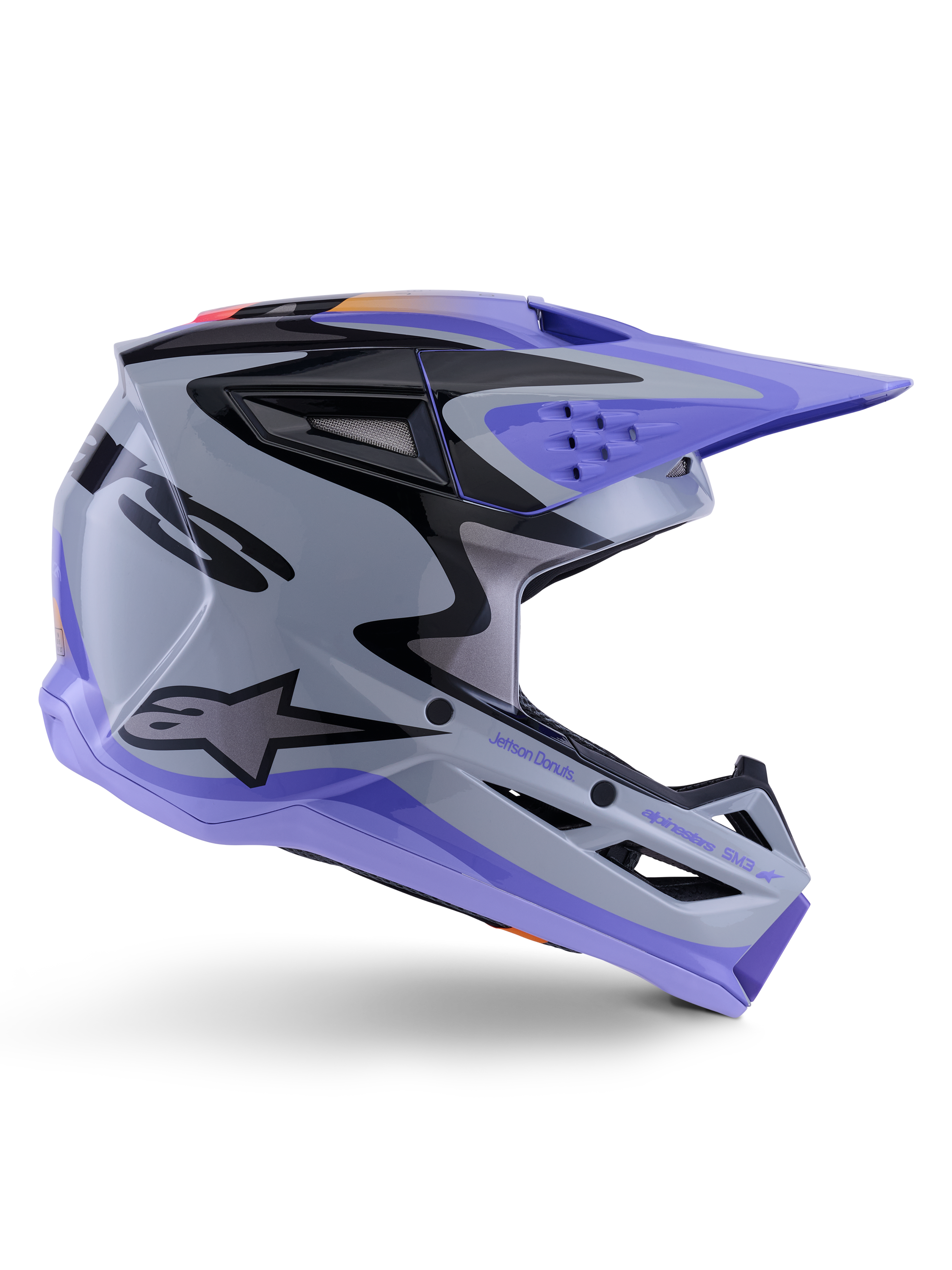 Alpinestars S-M3 Jettson Jugend-Helm, Motocross-Helm, Grau, Lila und Schwarz glänzend, Seitenprofil mit scharfen, kantigen Grafiken und 'Jettson Donuts'-Branding, aerodynamisches Schalendesign mit Belüftungsöffnungen und Alpinestars-Logo, hochleistungsfähige Offroad-Schutzausrüstung für Jugendliche