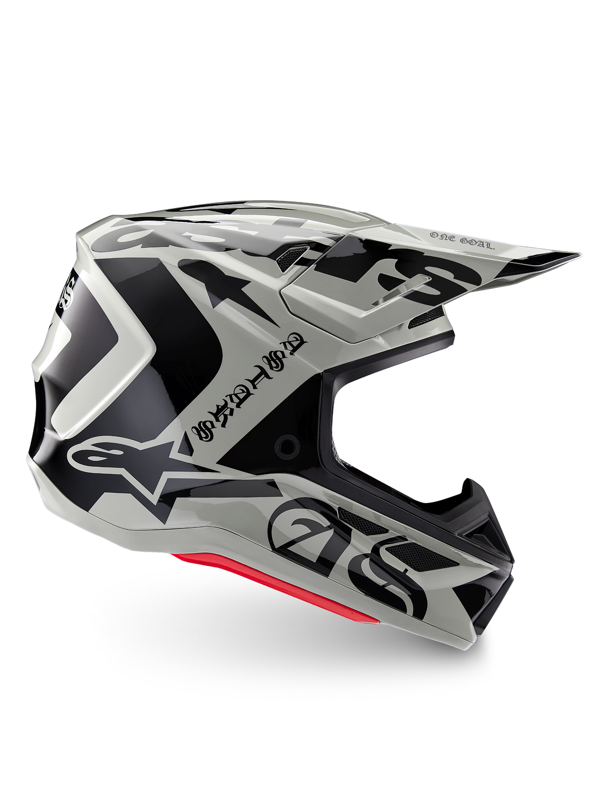 Alpinestars Limited Edition S-M7 Wolf Dust Helm, Motocross-Helm in Dune Black Glossy, Seitenprofil mit markanten schwarzen Grafiken und Branding, roten Akzenten an der Unterseite, aerodynamischer Offroad-Kopfschutz
