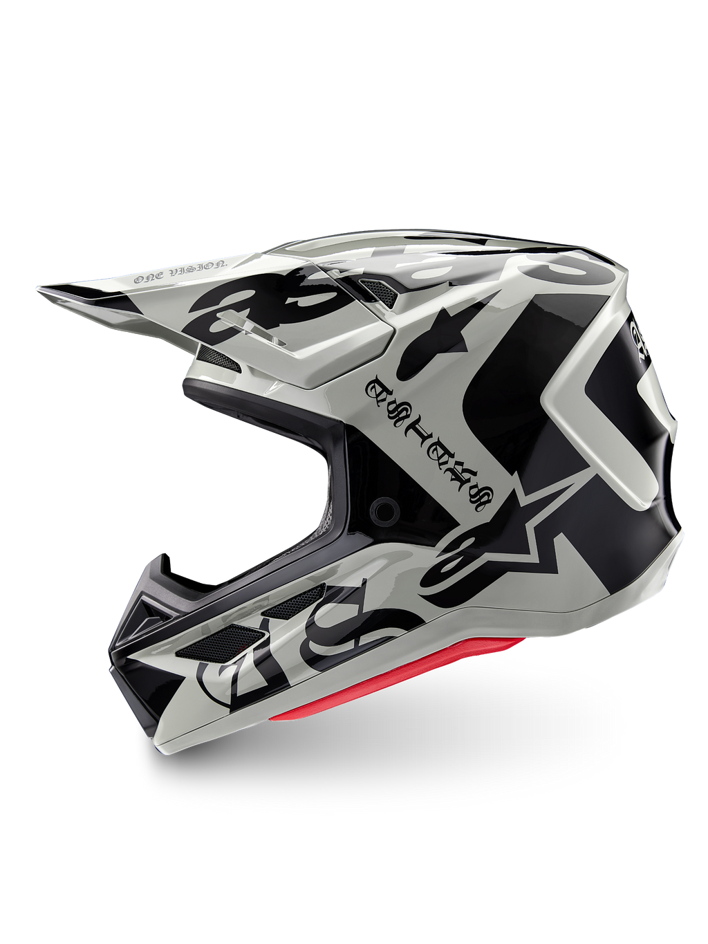 Alpinestars Limited Edition S-M7 Wolf Dust helm, motorcrosshelm, Dune Black Glossy, gebroken witte schaal met zwarte gotische ASTARS-branding en grafische patronen, rode binnenvoering zichtbaar, aerodynamisch profiel voor off-road racen