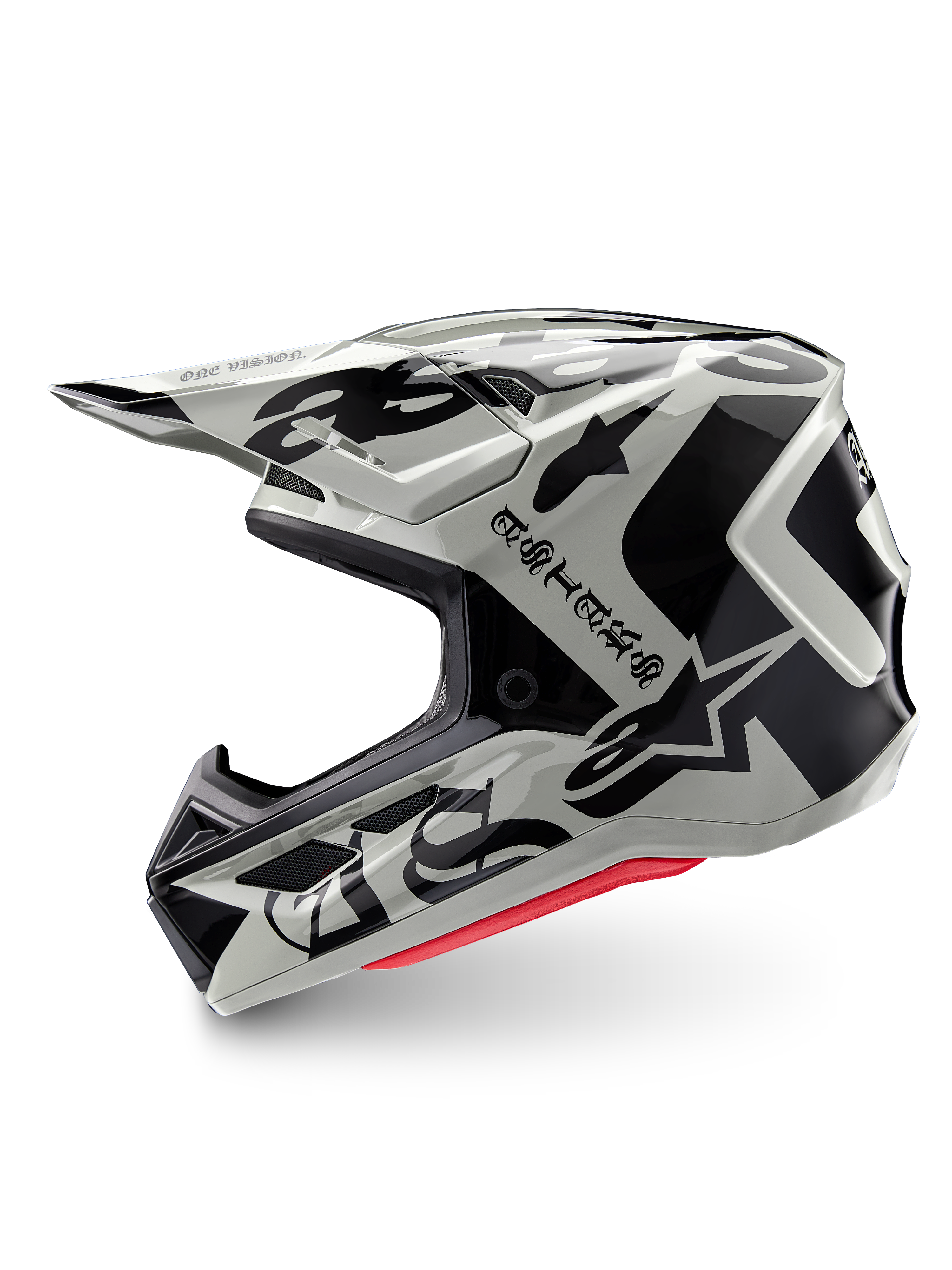 Alpinestars Limited Edition S-M7 Wolf Dust helm, motorcrosshelm, Dune Black Glossy, gebroken witte schaal met zwarte gotische ASTARS-branding en grafische patronen, rode binnenvoering zichtbaar, aerodynamisch profiel voor off-road racen