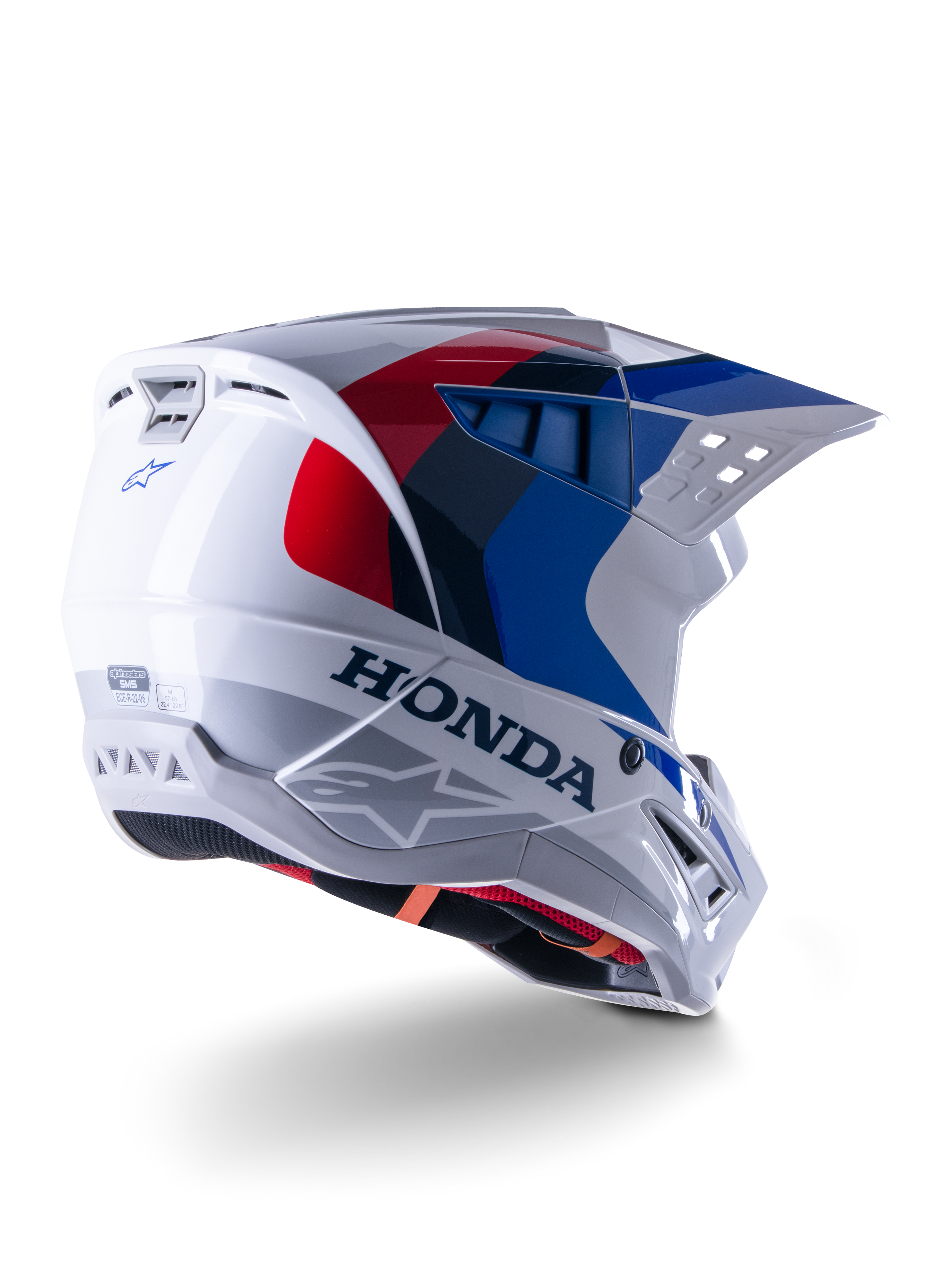 Alpinestars Honda S-M5 ECE-helm, motorcrosshelm, glanzend wit, blauw en rood, met opvallende Honda-branding en Alpinestars-logo's, aerodynamische schaal met geïntegreerde ventilatieopeningen en verstelbaar vizier, beschermende uitrusting voor off-road racen