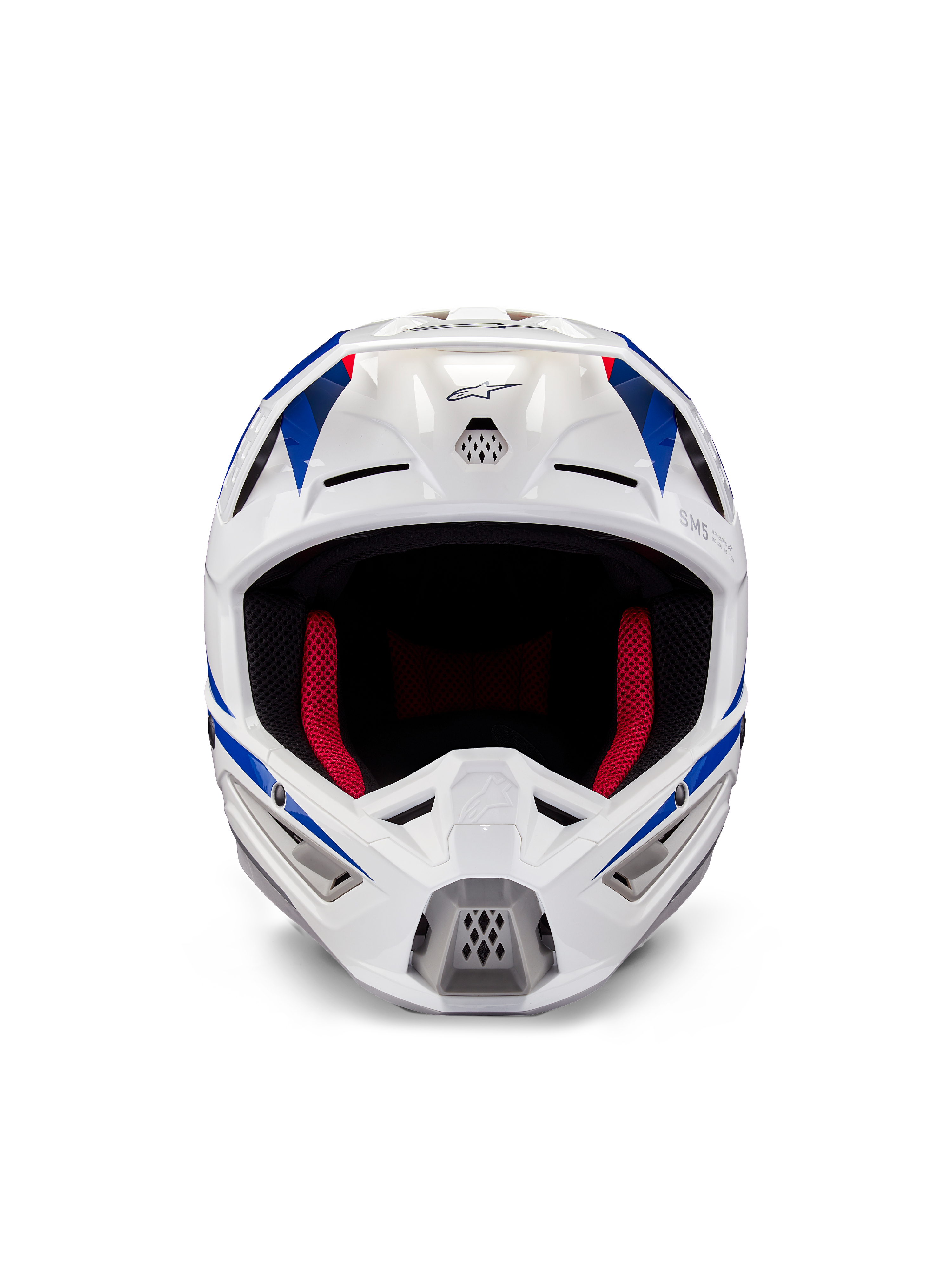 Alpinestars Honda S-M5 ECE helm, motorcrosshelm, wit blauw en rood glanzend, vooraanzicht met ventilatieopeningen en rode binnenvoering, aerodynamisch ontwerp voor off-road racebescherming