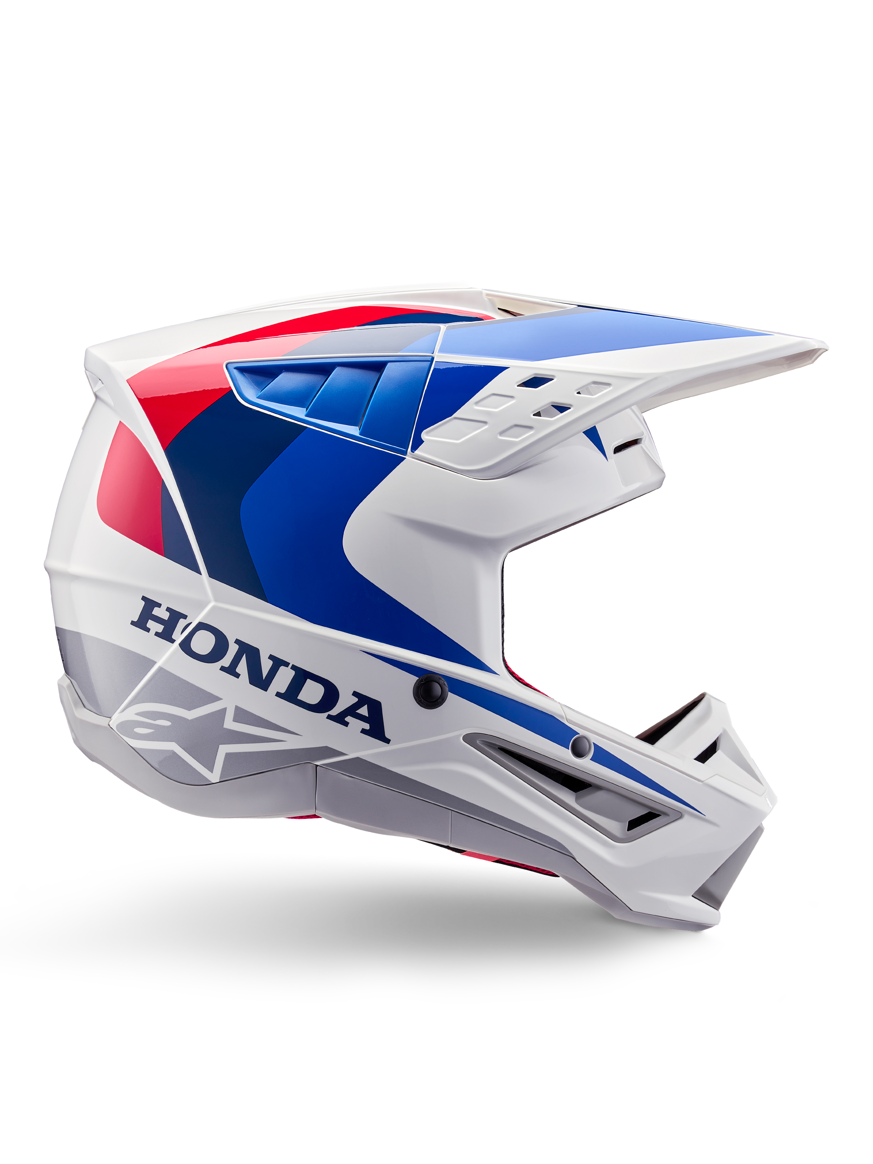 Alpinestars Honda S-M5 Helmet ECE, casque de motocross, blanc, bleu et rouge, vue de profil, design aérodynamique avec visière intégrée, nombreuses ouvertures de ventilation, finition brillante, marquage Honda et logo Alpinestars