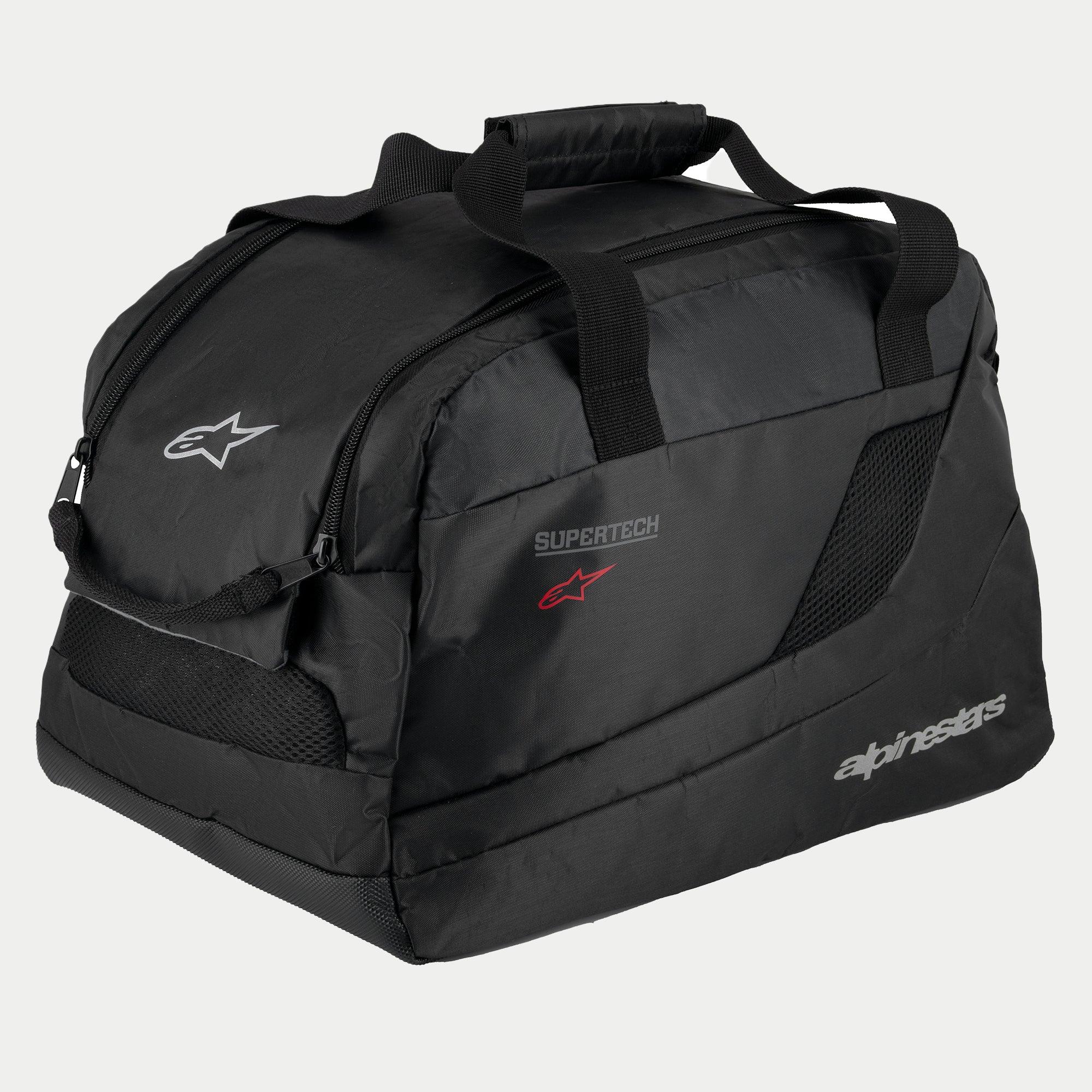 Sac à casque Alpinestars Supertech R10, noir, construction semi-rigide rembourrée pour casques de moto, doté de poignées de transport avec fermeture auto-agrippante, ouverture zippée, panneaux de ventilation en mesh et logos Alpinestars et Supertech réfléchissants