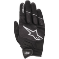 Gants Alpinestars Atom, gants de moto légers, noir et blanc, avec un grand logo d'étoile blanche sur le dos de la main, des panneaux en mesh pour la ventilation, des articulations rembourrées et une fermeture de poignet sécurisée par crochet et boucle