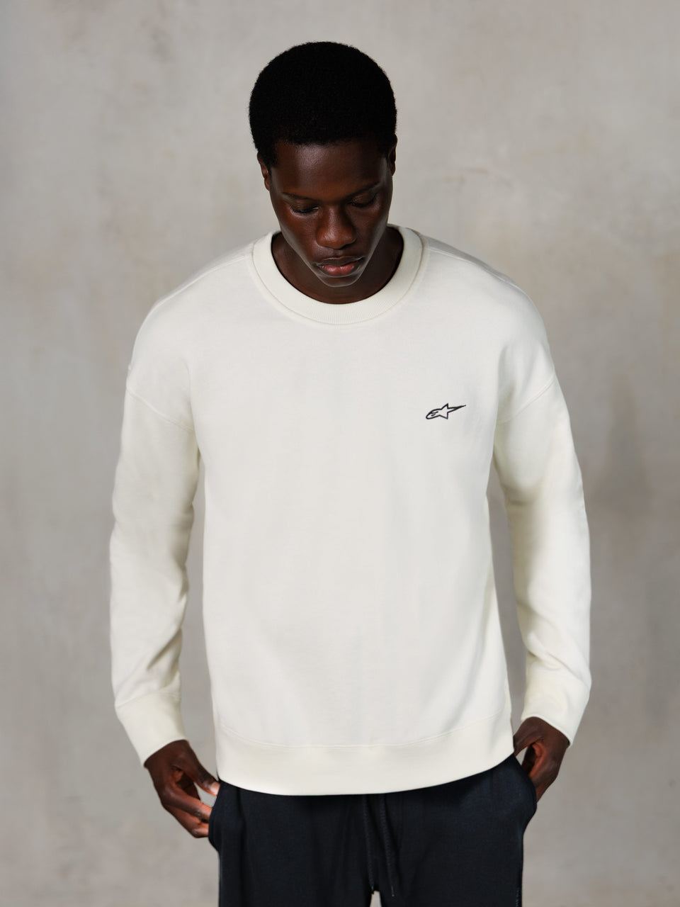 Alpinestars Essentials Ageless Crew, Crewneck Sweatshirt, Off White, small black Alpinestars logo on chest, worn by model, casual lifestyle streetwear, premium soft fleece