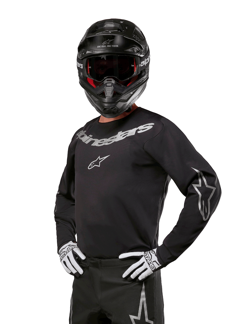 Alpinestars 2024 Fluid Graphite Gear Set, Motocross rider wearing black and gray jersey with bold gray logos, matching pants, black helmet, and white/black gloves, athletic sport fit for off-road motocross racing