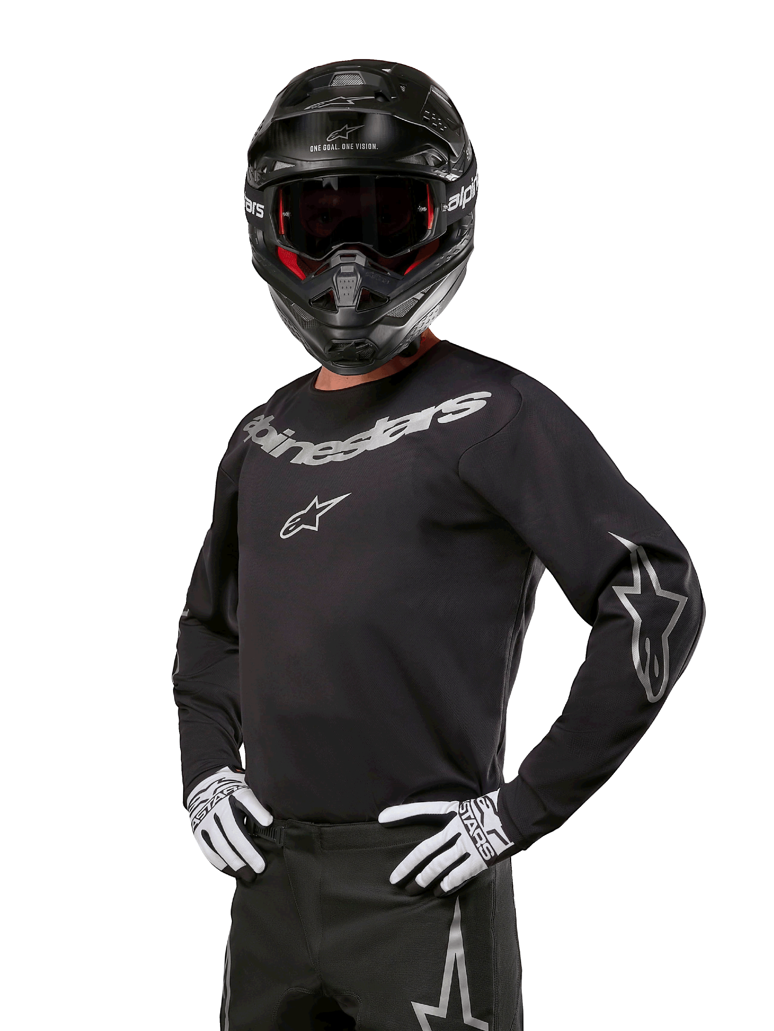 Alpinestars 2024 Fluid Graphite Gear Set, Motocross rider wearing black and gray jersey with bold gray logos, matching pants, black helmet, and white/black gloves, athletic sport fit for off-road motocross racing