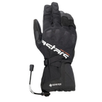 Alpinestars XT-5 GORE-TEX handschoenen, zwarte motorhandschoenen, met witte Astars-branding en oranje ADV-TECH tekst, lange manchet met bedekte knokkelbescherming, GORE-TEX logo en schokkoord sluiting, adventure touring uitrusting