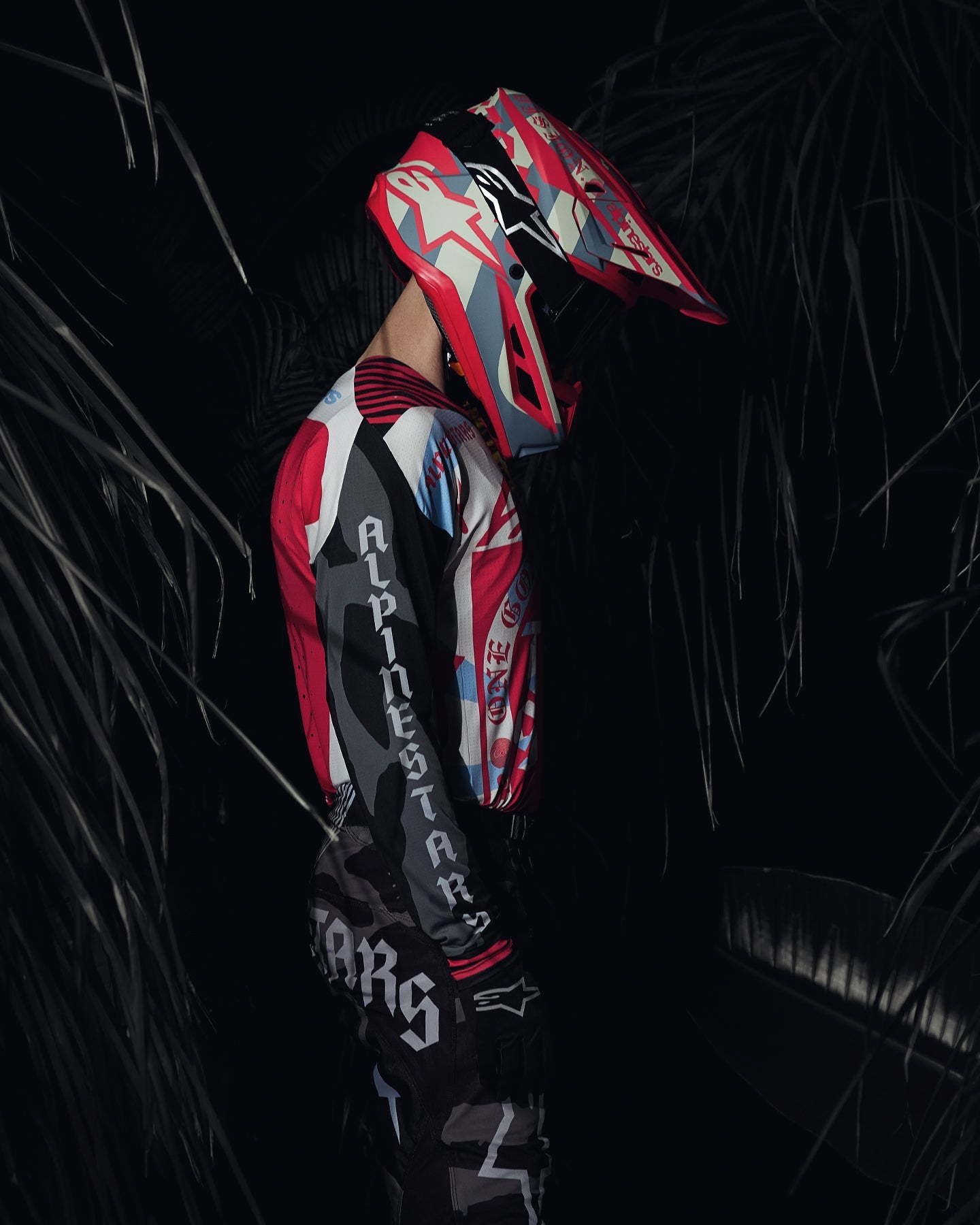 Alpinestars Limited Edition S-M7 Beast Coast Helmet and Visor, motocross gear, Light Gray and Hot Orange, tropical setting.
