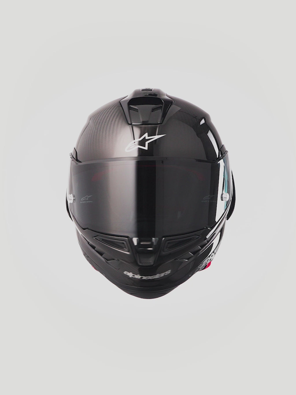 Alpinestars Supertech R10 Solid Helmet, Black Carbon racing helmet with aerodynamic carbon fiber shell and FIM certification.